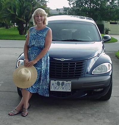 The Mrs. RATS herself standing in front of her service  car
